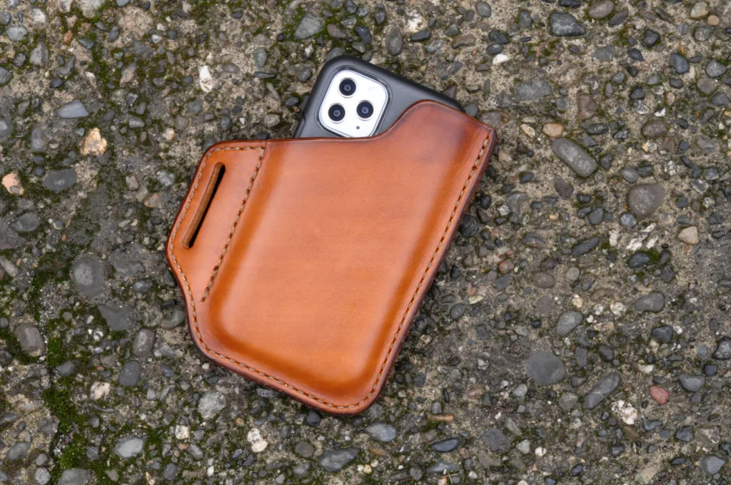 Front view of an iPhone holster made from hand dyed cognac leather