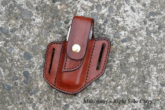 Front view of a Leatherman Surge multitool sheath shown in mahogany leather with a brass snap