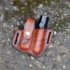 Front view of a Leatherman Wave and flashlight holder in hand dyed brown leather for right side carry