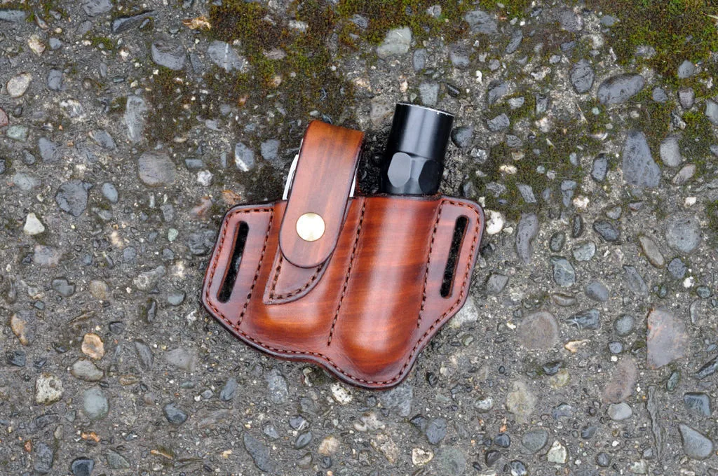 Front view of a Leatherman Wave and flashlight holder in hand dyed brown leather for right side carry