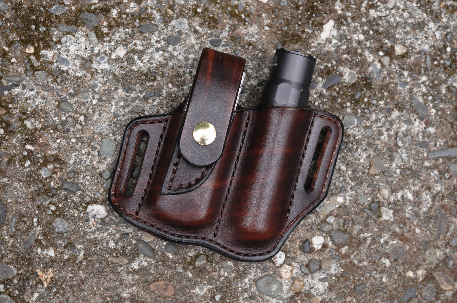 Front view of belt sheath for a Leatherman Free P4 multitool and flashlight shown in hand dyed chocolate brown leather