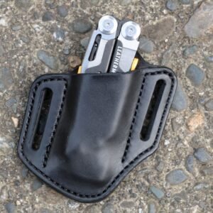 Front view of a black leather open top Leatherman Signal sheath sitting on a cement surface