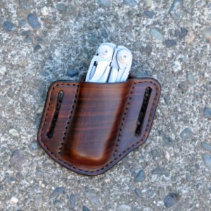 Front view of an open top belt sheath for a Leatherman Surge multitool shown in hand dyed brown leather.