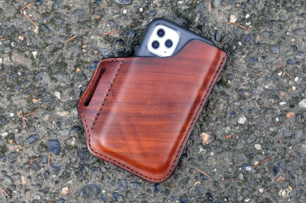 Front view of an iPhone holster made from hand dyed brown leather